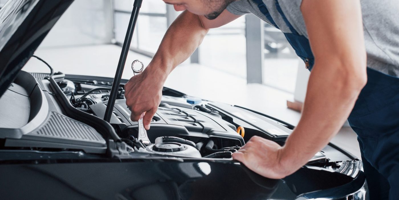 auto-mechanic-working-in-garage-repair-service